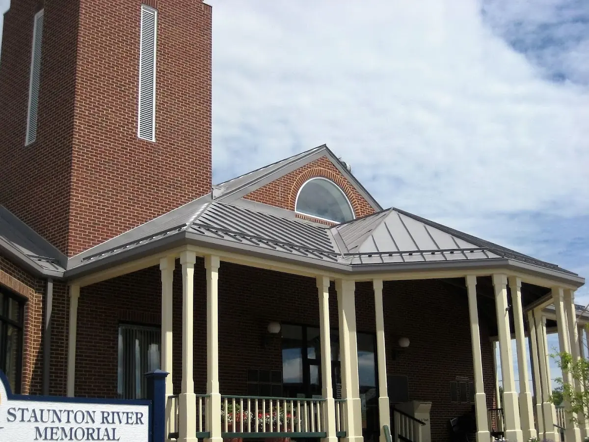 Skilled roofing craftsmen working on a residential roof in Marshall